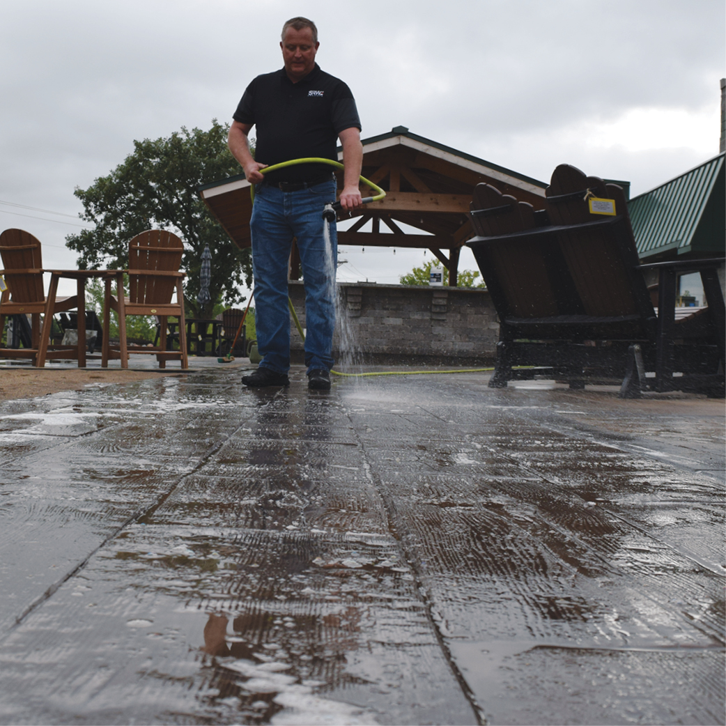 SRW Representative doing a demonstration with our pavement cleaner